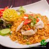 Chilli paste fried rice with onions, carrots, tomatoes, spring onions, green peas & eggs