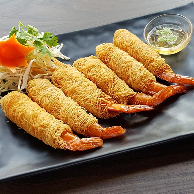 Crispy noodle-wrapped prawns served with plum sauce